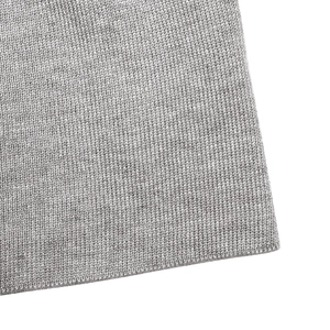 Close-up of gray knit fabric showing detailed stitching and soft ribbed texture detail