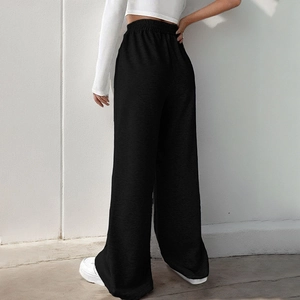 Women's black high-waisted wide-leg trousers with elastic V-waistband and relaxed fit