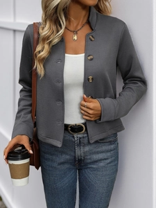 Detail of grey twill texture on a women's stand collar jacket with buttons