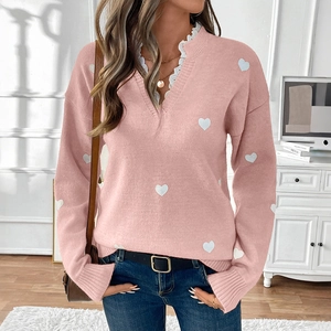 Pink V-neck knit sweater with heart patterns and elegant white lace collar detail