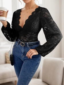 Close-up of elegant black lace bodysuit featuring a deep V-neck and scalloped eyelashes