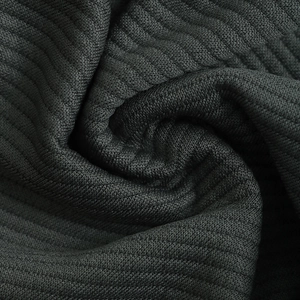 Macro shot of dark grey textured rib-knit fabric with high-density vertical stripes