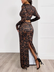 Detail showing leopard print fabric and high side slit of the slim fit long skirt