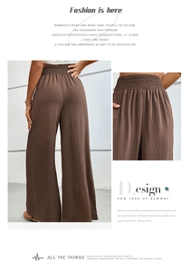 Detailed view of dark brown wide leg pants with comfortable elastic pleated waistband
