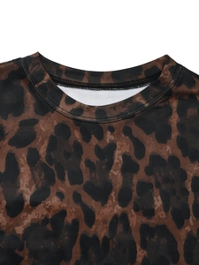 Close-up of leopard print crew neck top showing high-quality stitching and fabric texture