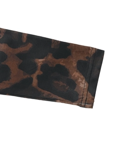 Close-up of leopard print sleeve cuff with durable double-needle stitching detail