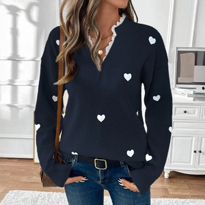 Women's V-neck navy knit sweater with white heart patterns and delicate lace trim