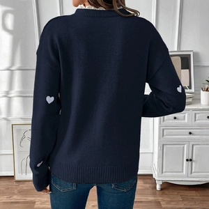 Rear view of navy blue sweater featuring white heart-shaped elbow patches on sleeves