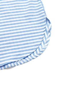 Detailed view of the blue and white striped shirt curved hem with clean stitching