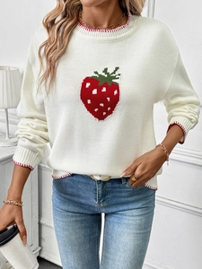 Detail of strawberry jacquard knit sweater with contrast red stitching on the collar and cuffs