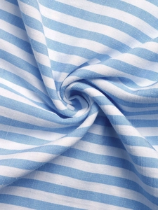 Macro shot of blue and white striped fabric texture with elegant draping folds