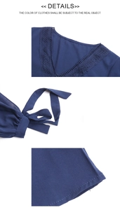 Detailansicht der dunkelblauen Spitzenbluse mit V-Ausschnitt, Häkelspitze und Bindeschleife