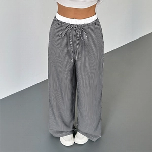 Pantaloni larghi minimalisti a righe bianche e nere da donna con coulisse in vita elastica