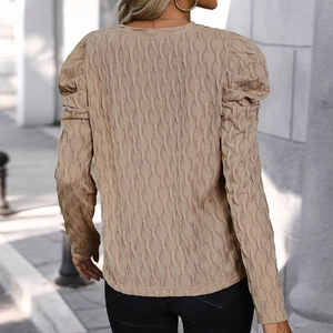 Slim fit beige textured long sleeve top with puffed shoulders and V-neckline for women