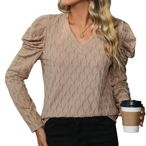Women's V-neck long sleeve knit top in apricot color with textured puff sleeves and ripple fabric