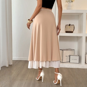 Women's A-line long skirt in beige with layered white pleated hem and button detail