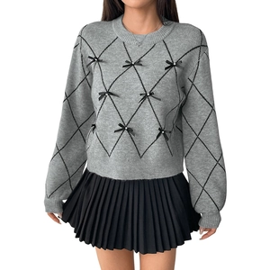 Women's grey knit sweater with black argyle pattern and decorative ribbon bows with pearls