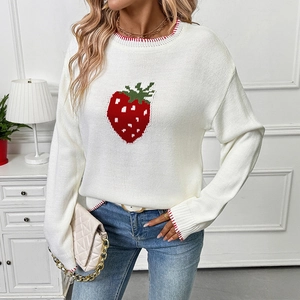 White crew neck knit sweater with strawberry pattern and red striped cuffs on a model