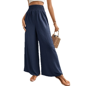 Pantalon large bleu foncé à taille haute, tissu texturé et ceinture élastique