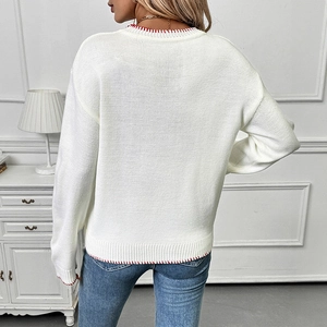 White knit sweater with strawberry jacquard and red stitched hem shown from the back view