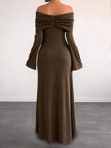 Detail of elegant deep brown rib-knit long dress featuring back ruching and off-shoulder cut