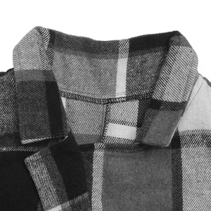 Close-up of the vintage plaid vest showing the turn-down collar and thick twill fabric