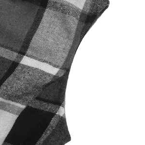 Close-up of black and white plaid vest with detailed twill fabric and high-quality stitching