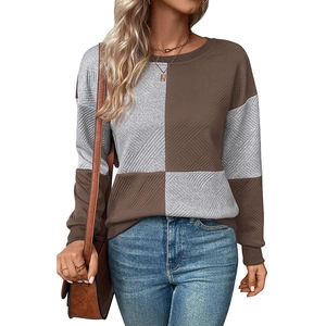 Women's crewneck color block sweatshirt with textured grey and brown checkered panels