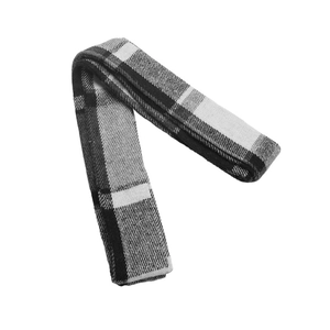 Close-up of the thick plaid texture and soft fabric on a black and white checkered vest