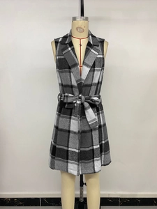 Detail view of plaid vest dress with lapel collar and waist tie for autumn layer