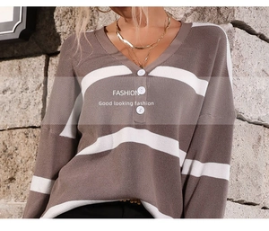 Detail of V-neck stripe sweater with three buttons and soft knit texture close-up