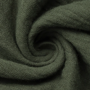 Macro trama del tessuto di lino verde scuro che mostra la trama e fibre naturali