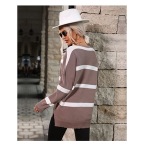 Detail of oversized v-neck striped sweater with side slits and loose fit for women