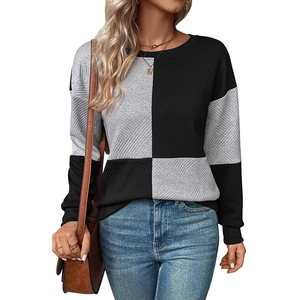 Detail of color-block textured sweatshirt with ribbed fabric and round neckline