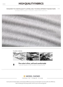 Macro detail of high-quality grey heather knit fabric showing texture and sewing process
