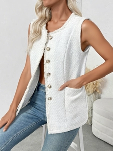 Detail of white tweed vest with embossed metal buttons and elegant fringe trim edges
