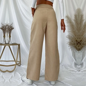 Women high waist khaki corduroy wide leg trousers in a stylish casual street style back view