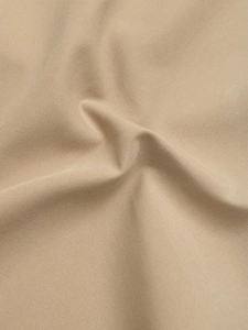Close-up of khaki woven fabric showing premium texture on autumn cardigan jacket