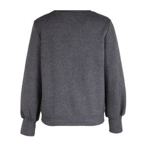 Detail showing high-density geometric jacquard texture and knitted fabric of dark grey sweatshirt