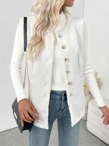 Detailed texture of white tweed vest with gold metal buttons and raw fringe edges