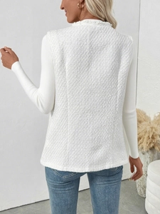 Detailed back view of a white tweed vest with fringe edges and premium woven texture