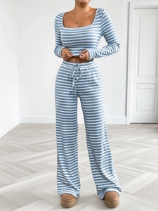 Detail of blue and white striped pajama set with long sleeve crop top and wide leg pants