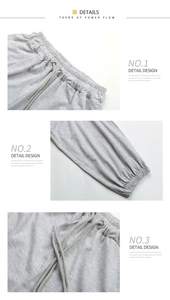 Detail view of high waist sweatpants showing elastic drawstring waist and ribbed cuffs
