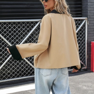 Short khaki contrast collar jacket with large folded cuffs and light wash denim jeans