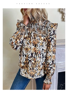 Detail of smocked high neck and leopard print fabric on a long sleeve women blouse