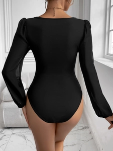 Close-up of the elegant mesh sleeve detail and square back design on a black bodysuit