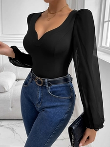Detail of black V-neck bodysuit featuring sheer mesh lantern sleeves and fitted silhouette