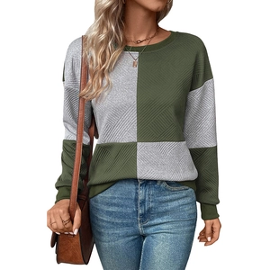 Detail of color-block crewneck sweatshirt with textured fabric and ribbed cuffs