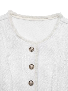 Close-up of white tweed vest featuring fringed edges and embossed metallic buttons