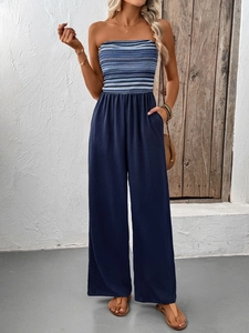 Detail of strapless striped jumpsuit with elastic high waist and wide-leg trousers